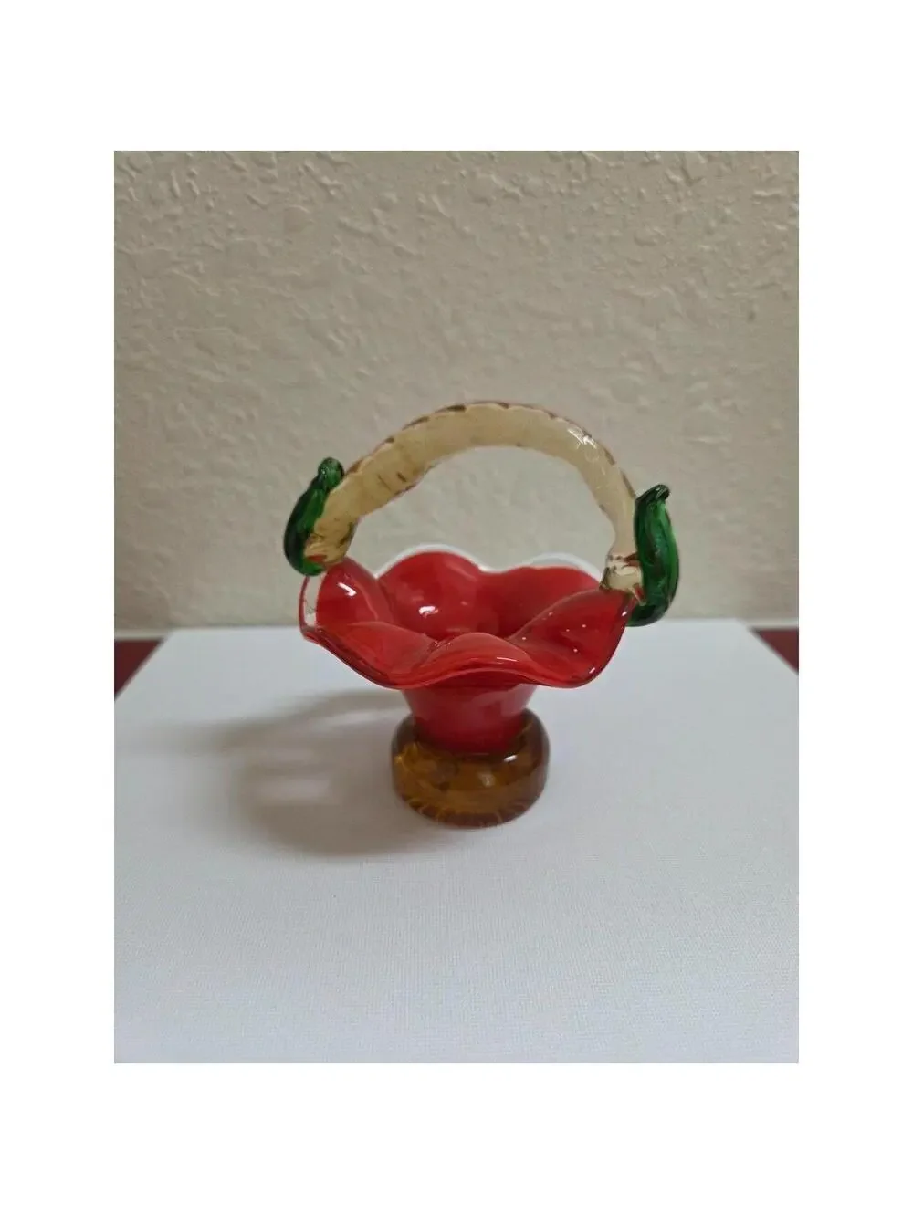 Vintage hand blown art Glass basket. Red, tan and green in color.